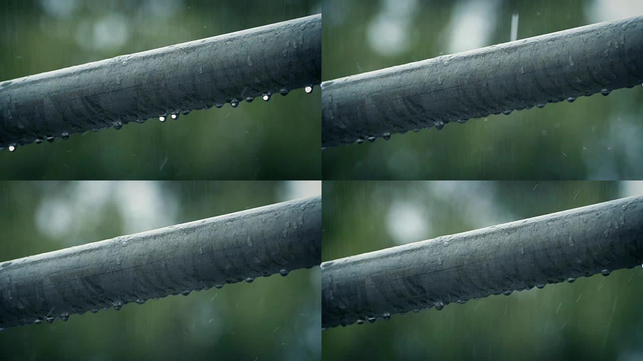 雨中滴落的金属杆