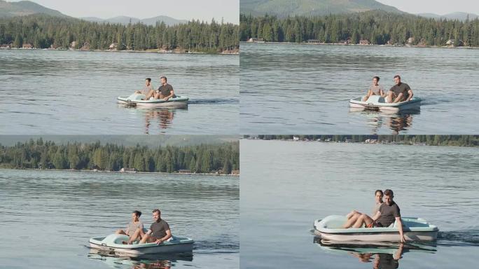 夫妇在平静的湖上使用划桨船