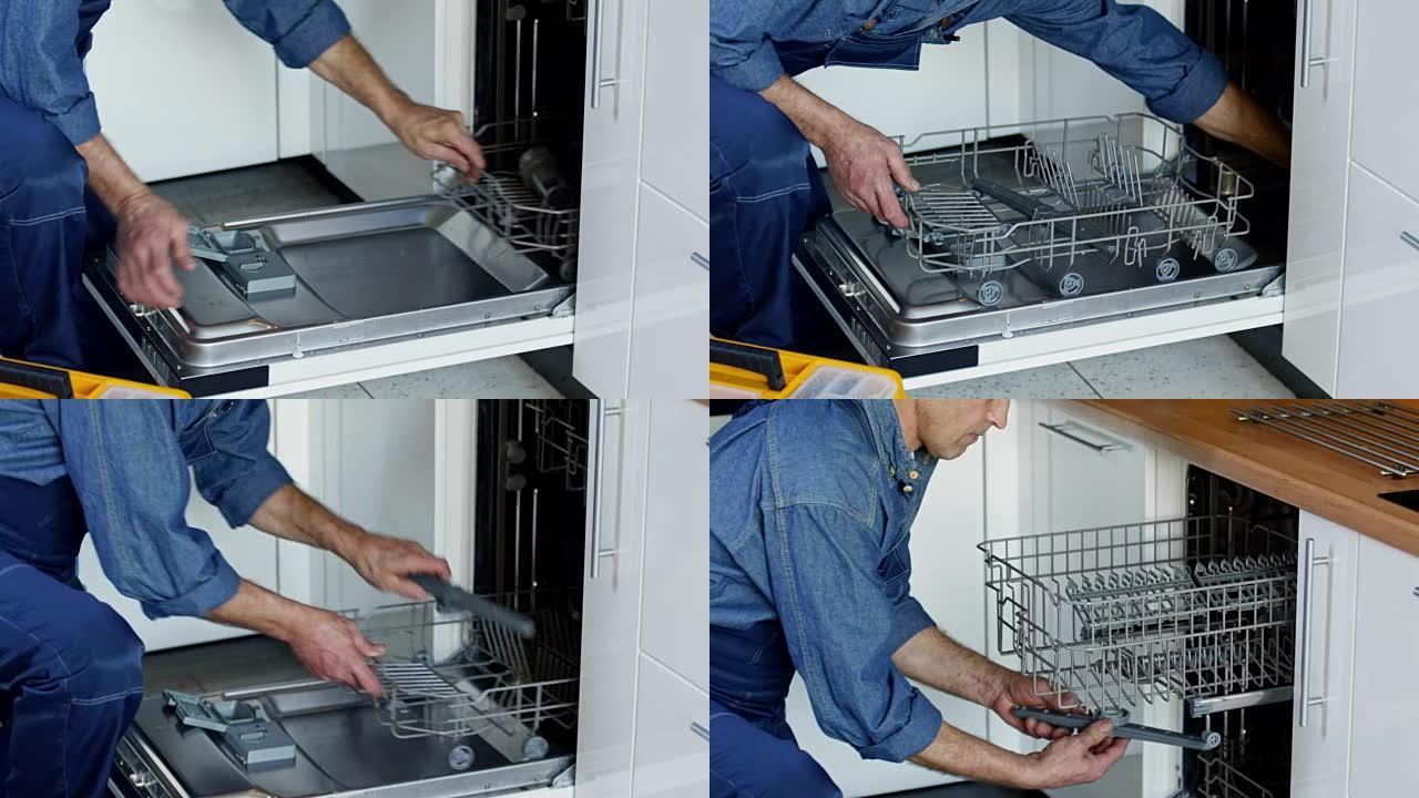 男性水管工在厨房安装洗碗机