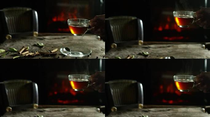 凉茶和茶的美丽浪漫成分被倒在旧的木制砧板上，背景为香料，壁炉
