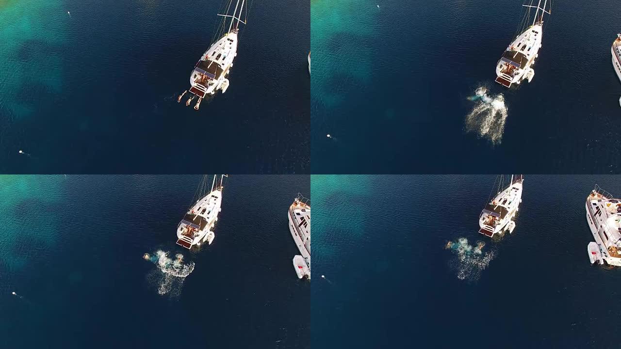 空中人员从帆船上跳入海中