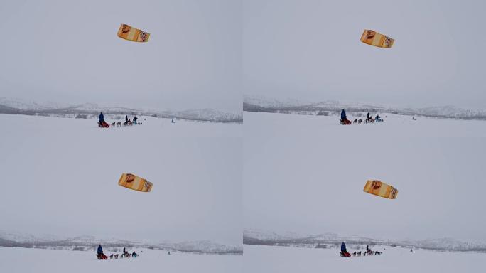 挪威的SLO MO狗拉雪橇和风筝冲浪