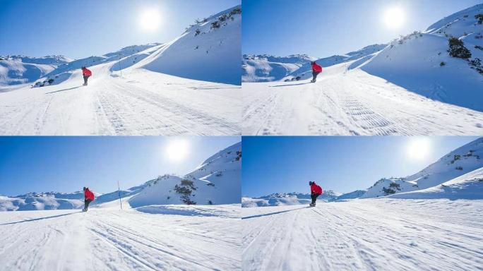 滑雪者下坡骑行，蹲下以获得更高的速度