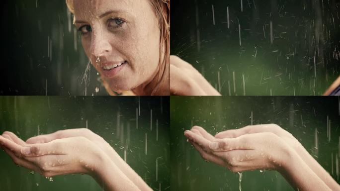 女人在夏雨中享受并握住她的手