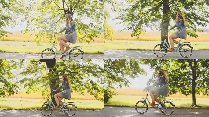 TS年轻女子在骑自行车时打电话