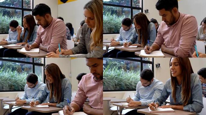 一群学生在笔记本上做笔记，注意上课
