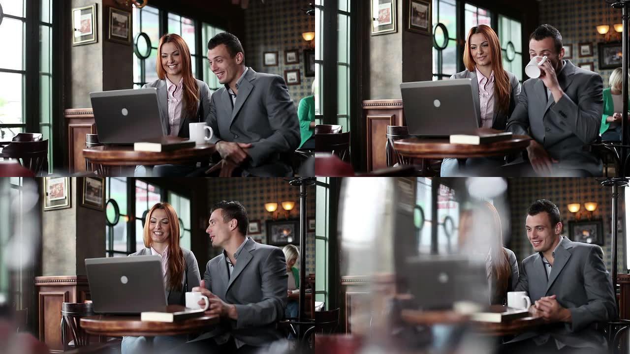 咖啡馆里的男人和女人用笔记本电脑。