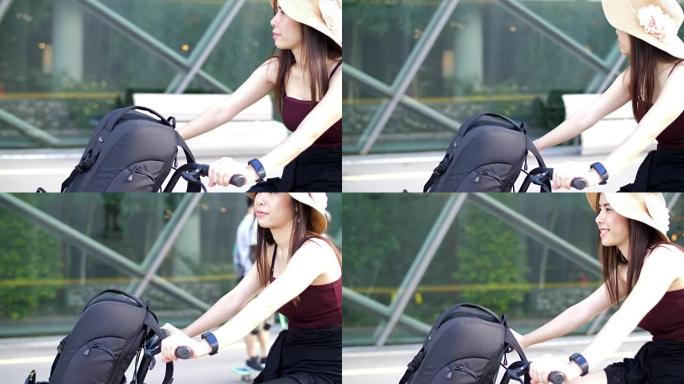 年轻女子在新加坡城市骑自行车
