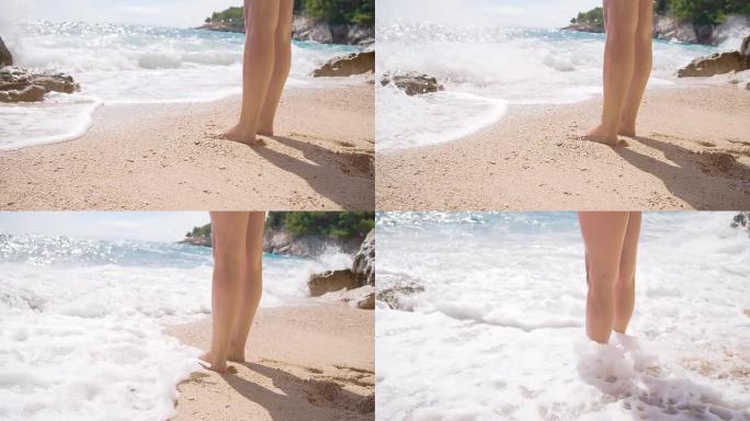 SLO MO海滩上的女人腿