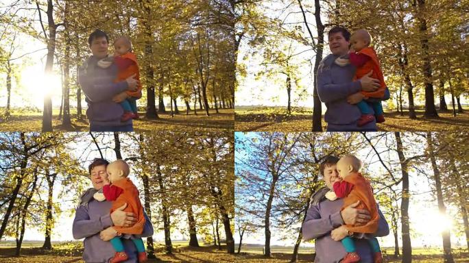 SLO MO父亲和婴儿享受秋天