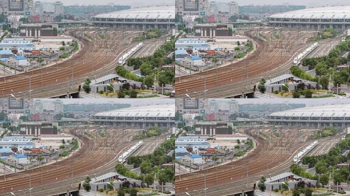 延时-北京南站火车穿梭动车行驶交错的铁轨