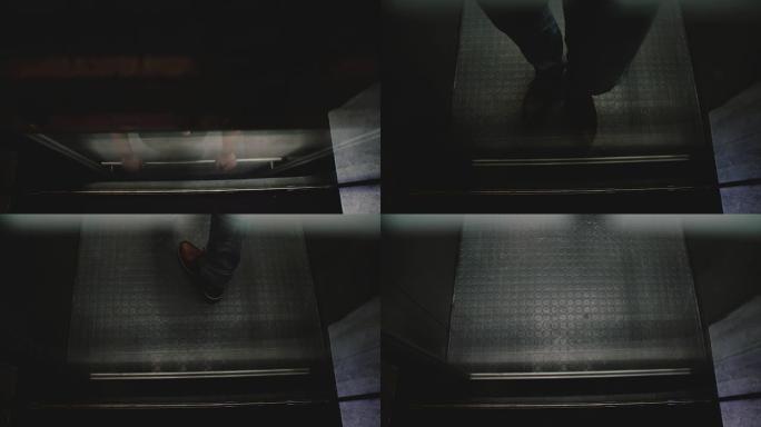 穿着棕色鞋子的欧洲年轻人骑着电梯走了出来，透过透明的玻璃墙看到了，高角度的景色