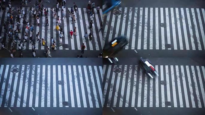 著名的涩谷行人拥挤人行横道的高角度延时拍摄，人群横穿人行横道。晚上在大城市。