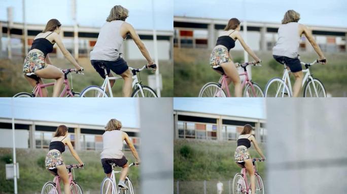 年轻夫妇在骑自行车上玩得开心