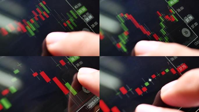 智能手机上的手指索引股票市场数据图。