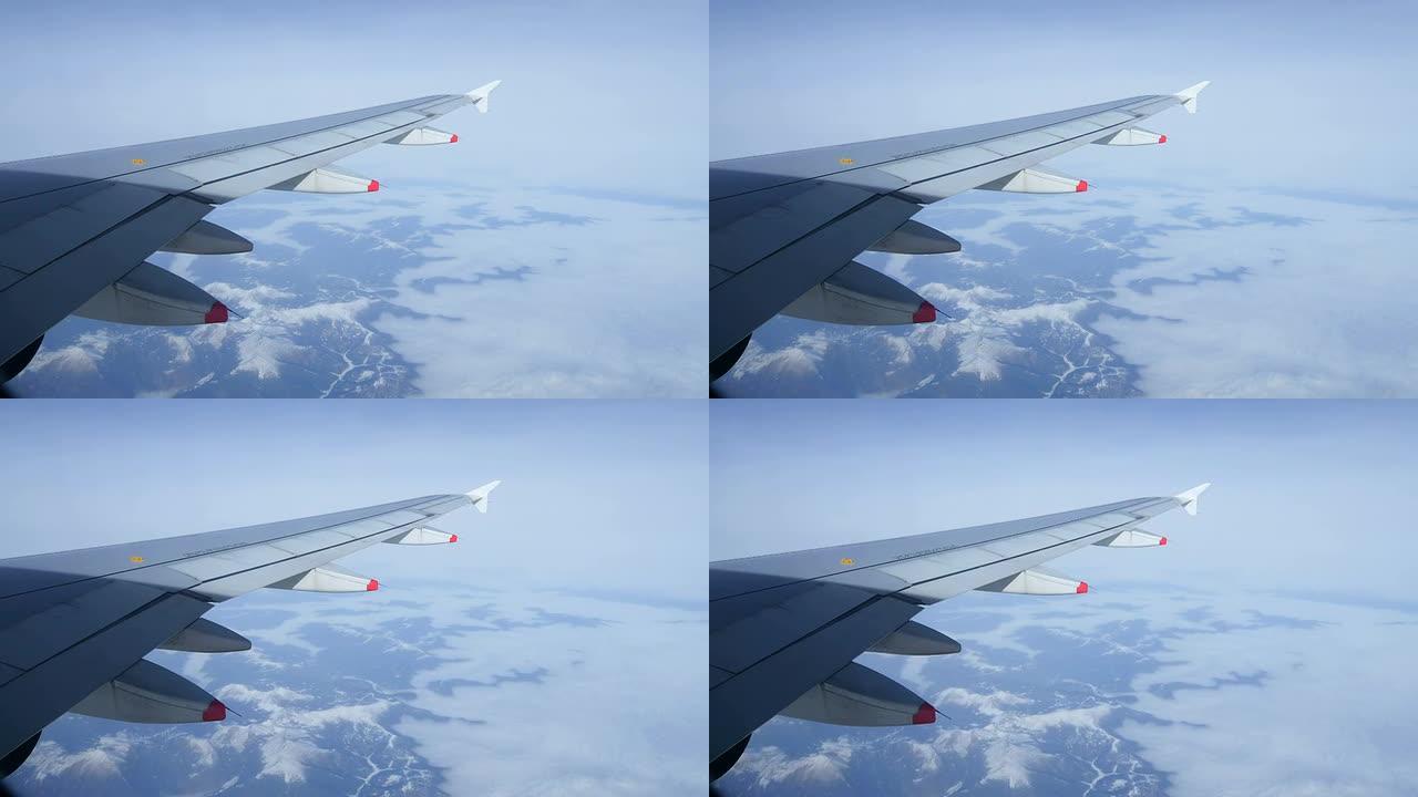 通过飞机窗户观看云海高空机翼机舱窗外