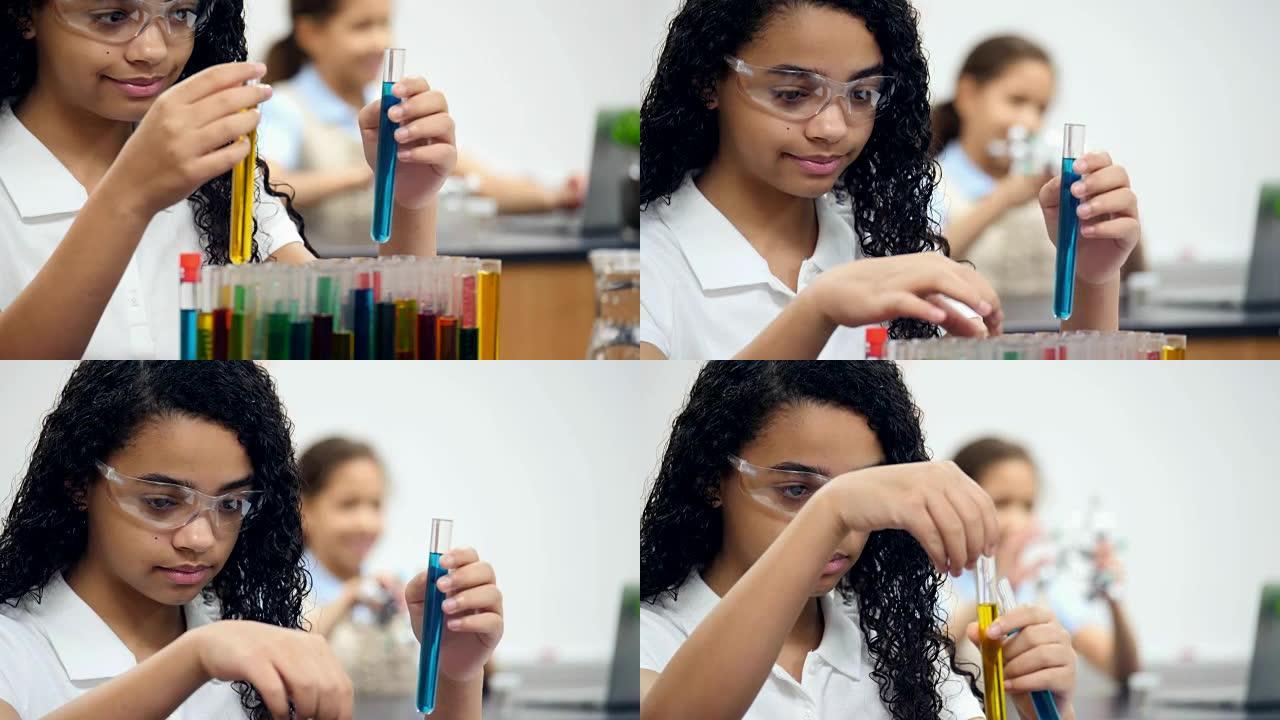 非裔美国女STEM中学生在试管中学习液体