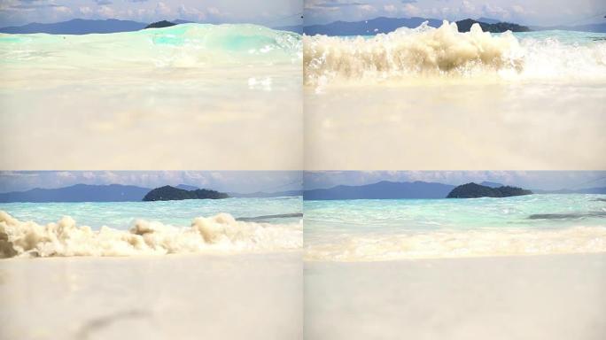 泰国白沙热带海滩上海浪的慢动作。
