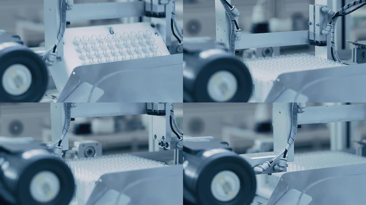 工业制造医疗试管的特写镜头，分拣和包装过程。无菌高精度工厂机械生产医疗用品。抽象工业概念。