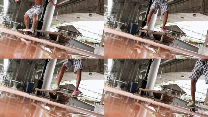 特写慢动作: 滑板运动员的极限运动HDR视频。滑板运动员跳跃kickflip技巧。