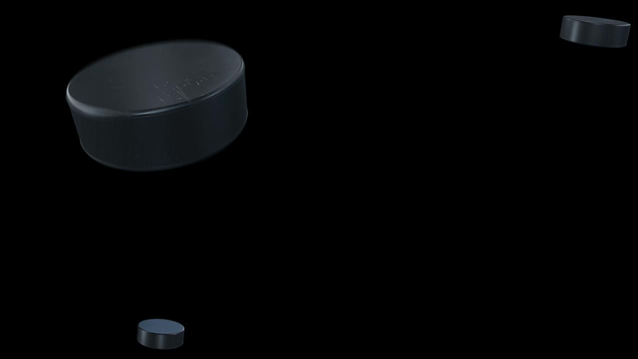 一套4个视频。美丽的冰球在黑色背景下以慢动作击中相机。飞球孤立的曲棍球3d动画。运动概念。