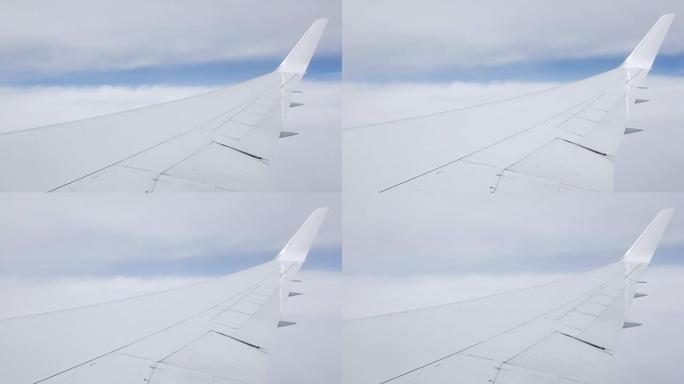 飞行过程中飞机窗口的云层视图