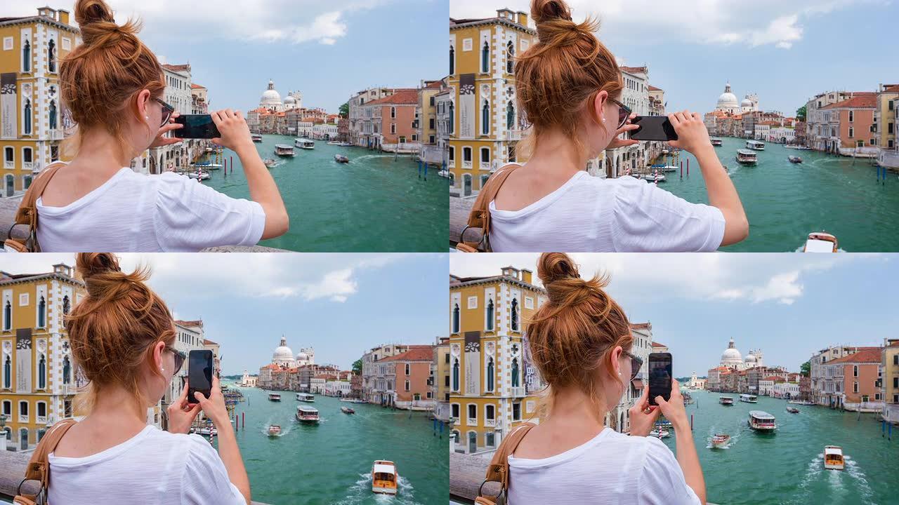 年轻女游客为意大利威尼斯拍照