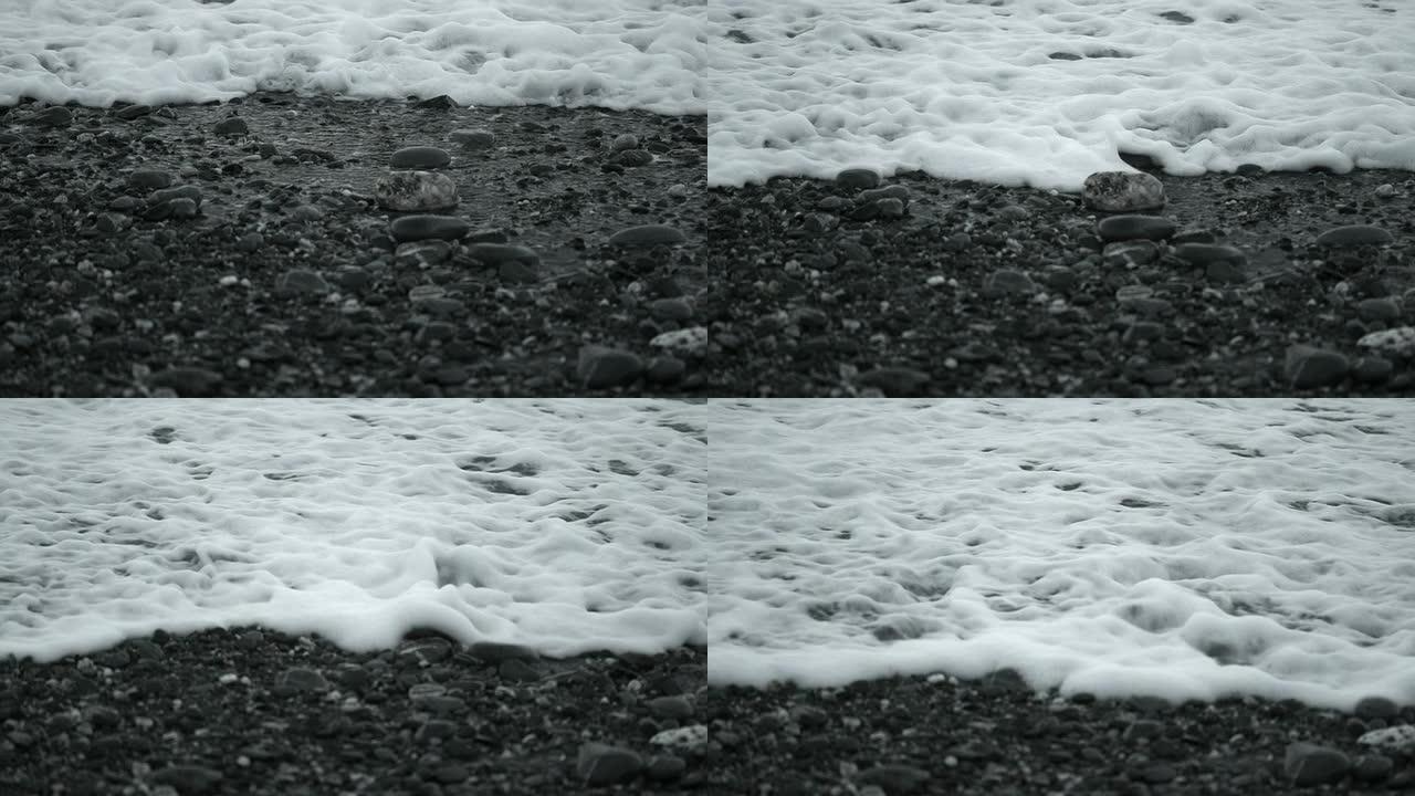 缓慢运动：泡沫在砾石上流动