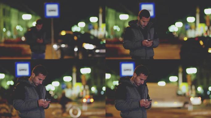 年轻男子女士晚上在城市使用智能手机