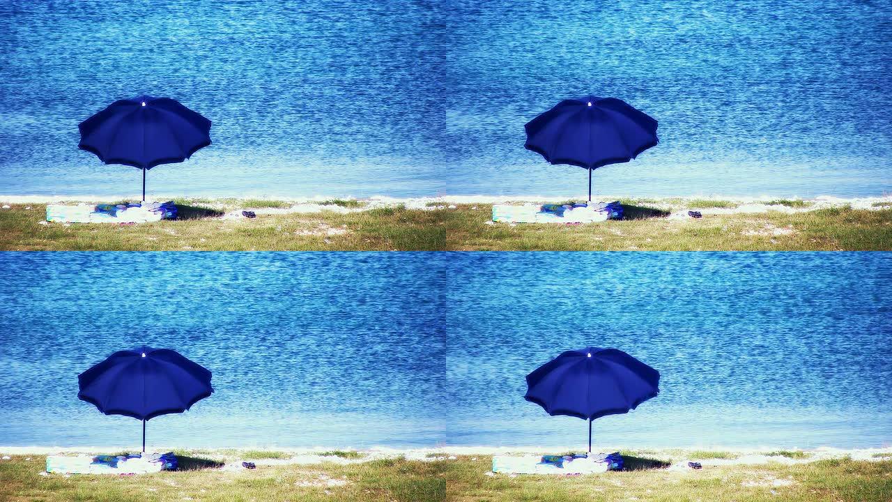 高清：海滩场景与遮阳伞和毛巾