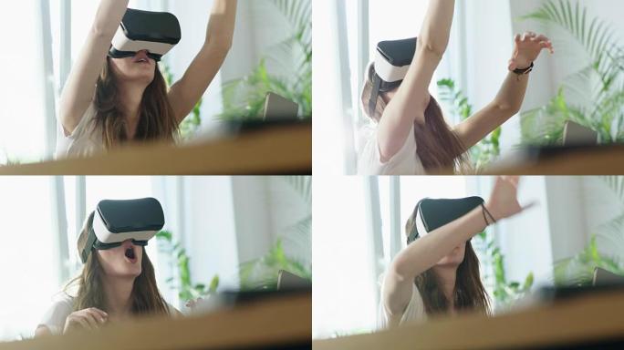 使用虚拟现实眼镜的年轻女子。触摸大假想物体