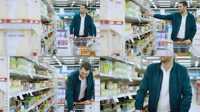 在超市: 英俊的男人在罐头食品的货架上浏览，选择锡罐并将其放入购物车。