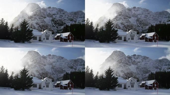 白雪覆盖的房子雪山脚下田园风光清晨早晨