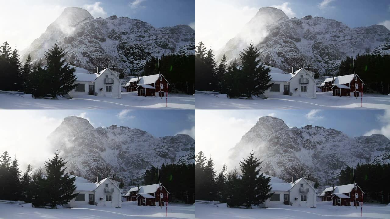 白雪覆盖的房子雪山脚下田园风光清晨早晨