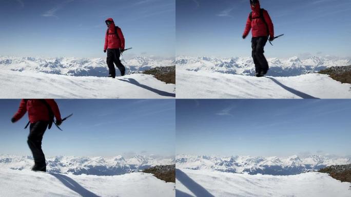 登山者在山上的雪地上行走