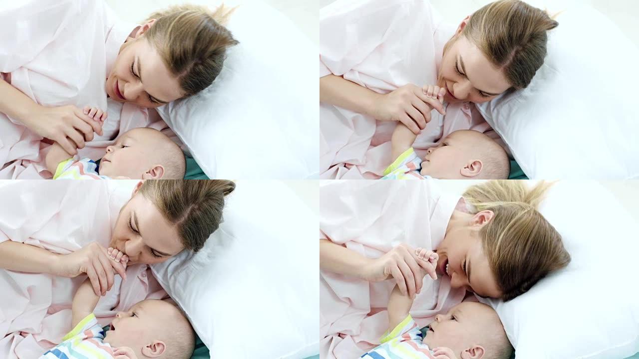 母亲亲吻婴儿的手升格视频母爱宝宝温暖爱的