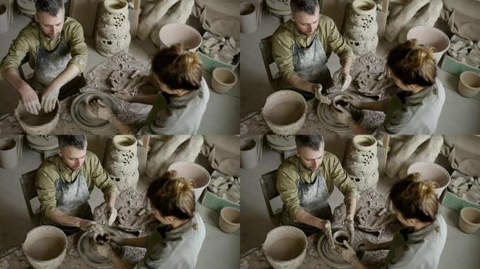 在陶器作坊工作的男人和女人