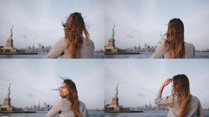 快乐的旅行者女人，头发在风中吹，在自由女神像的船上享受纽约天际线慢动作
