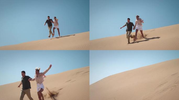 沙漠中的情侣旅行旅游牵手奔跑度假休闲