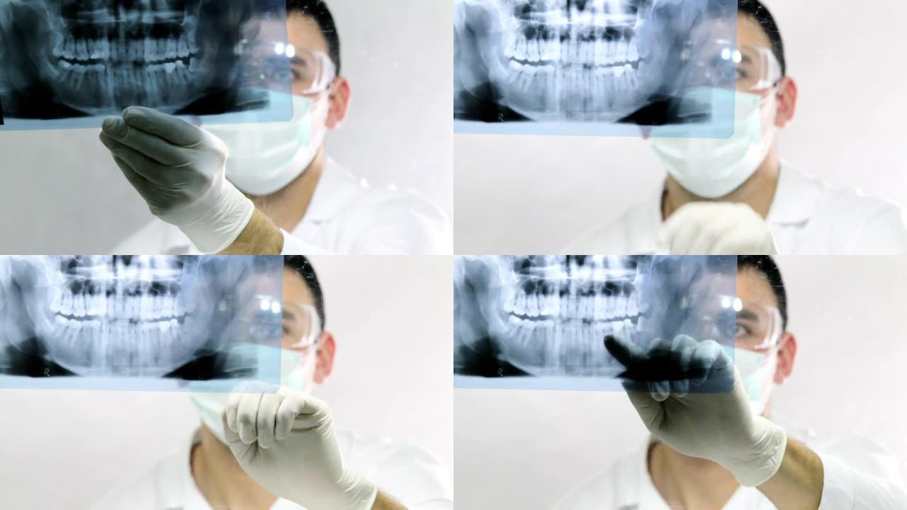 牙医正在看牙齿x光片。