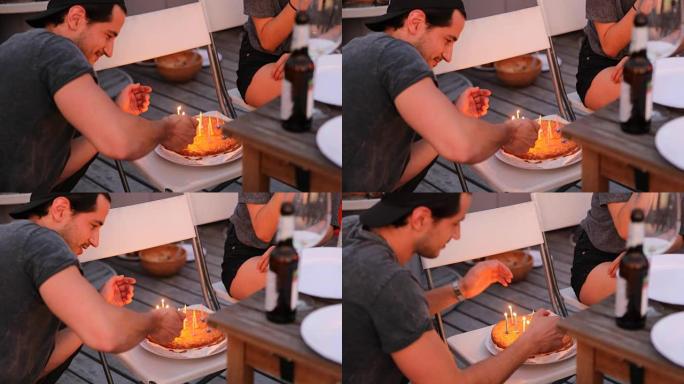年轻人用打火机点燃蛋糕上的蜡烛