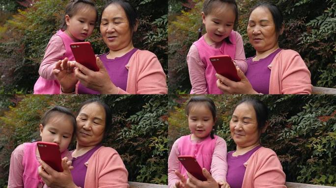 奶奶和孙女一起用手机，4k