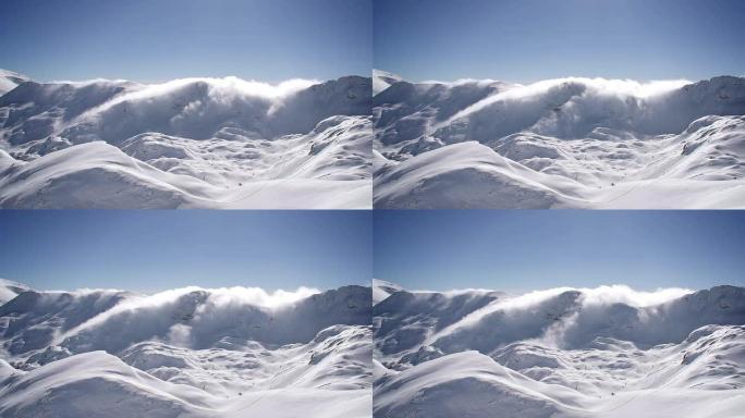 白雪皑皑的群山上的云朵