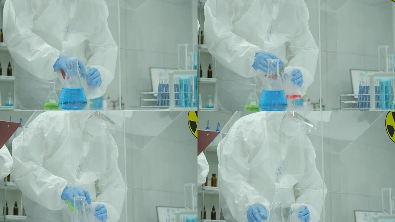在安全的高水平研究实验室中，科学家将试管中的吸烟化合物与烧杯中的物质混合在一起