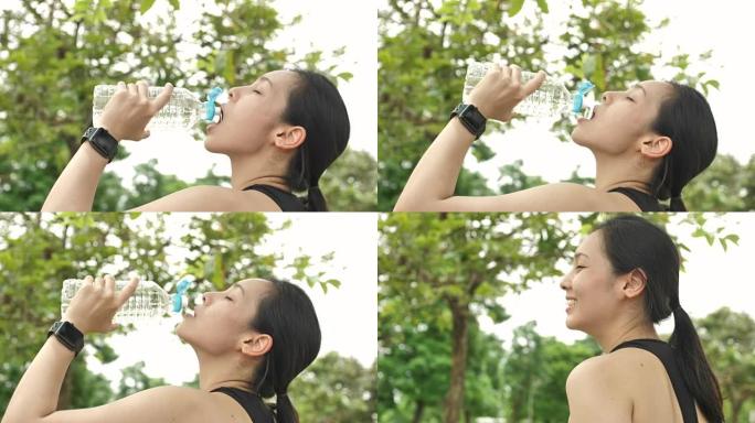 年轻女子运动后喝水