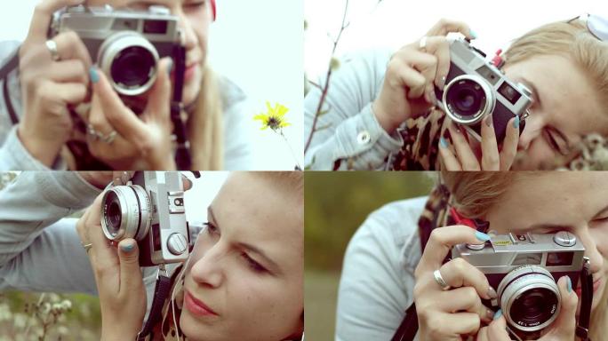 年轻女子用复古相机拍照