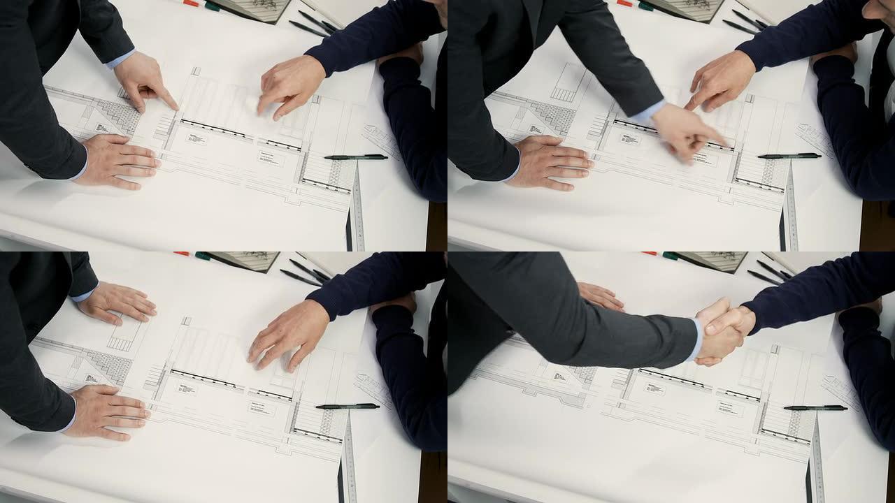 建筑师握手工程设计师产品建筑画图纸握手合
