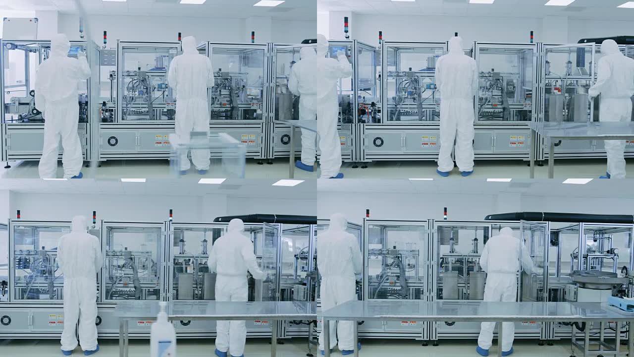 制造实验室的科学家在保护工作服的工作与工业高精度3D打印机械。制造制药/技术/工业产品。