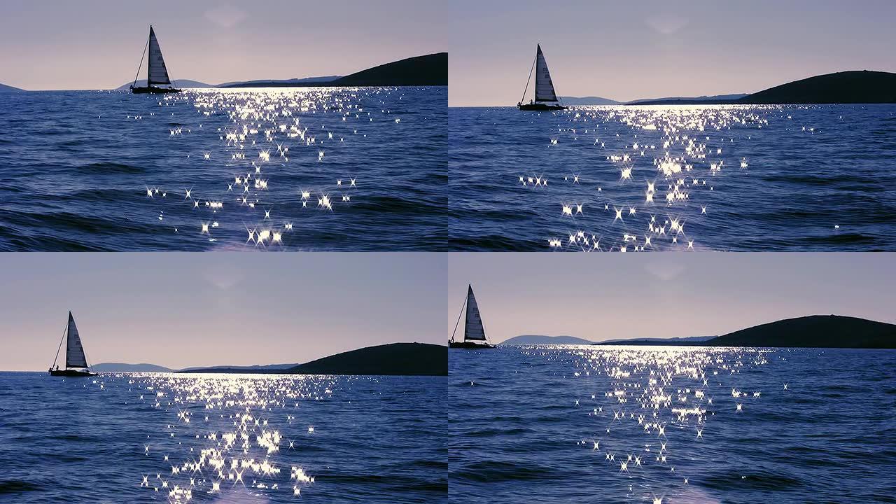 高清：日落时的海上帆船