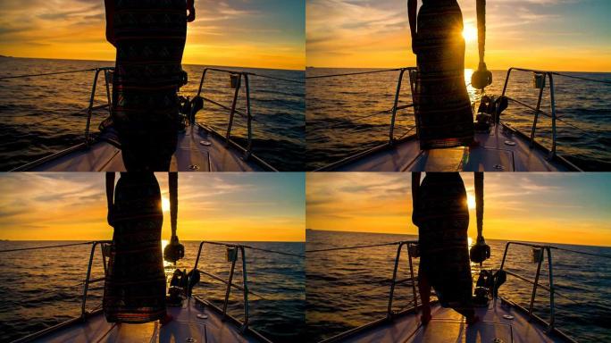 女士乘帆船弓海上日落